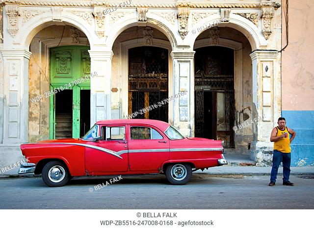 Crumbling old buildings and classic car, Havana, Cuba