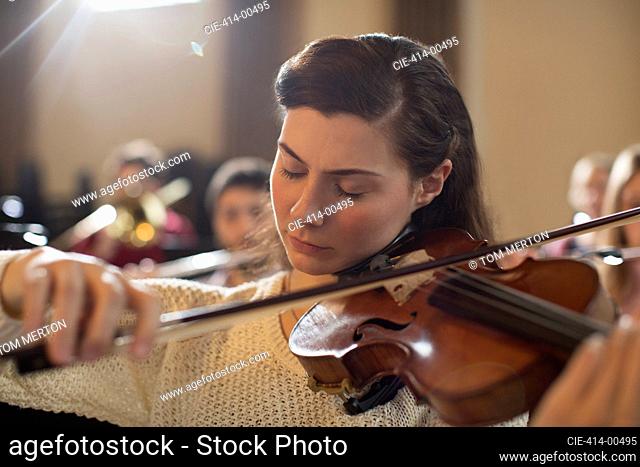 Violinist performing with eyes closed