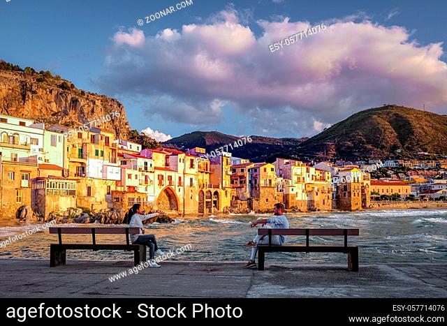Cefalu, the medieval village of Sicily island, Province of Palermo, Italy. Europe, a couple on vacation at the Italian Island Sicilia