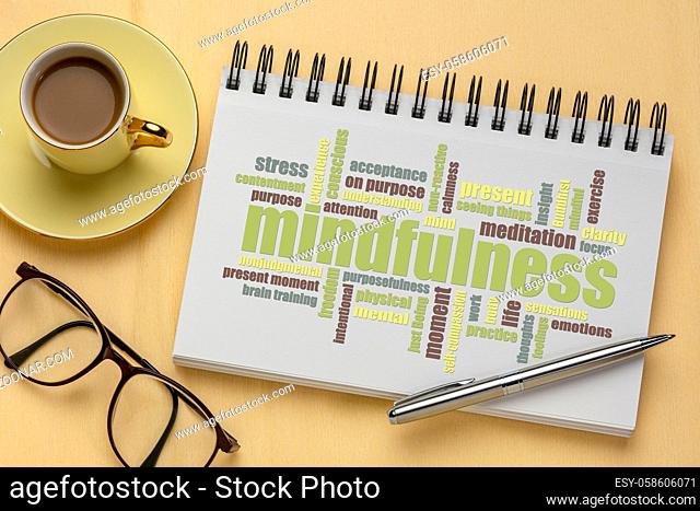 mindfulness word cloud - color text in a sketchbook with a cup of coffee, self awareness and lifestyle concept