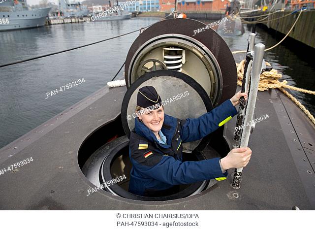 Lieutenant Janine Asseln boards the submarine U-32 at the port of the Naval Base in Eckernfoerde, Germany, 02 April 2014