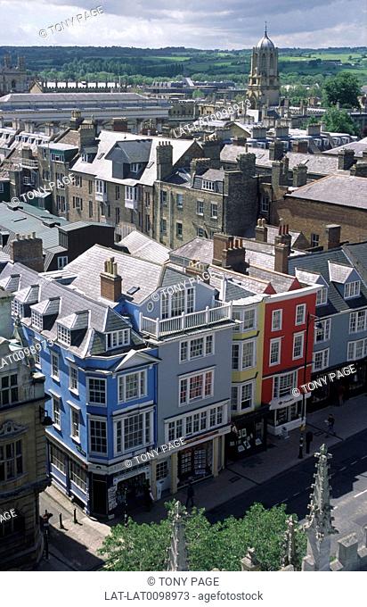 Rooftops viewed from tower. Buildings. Painted walls, blue, red