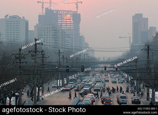 Commuters battle through rush hour traffic on one of Beijing's main thoroughfares, Gongren Tiyuchang Beilu