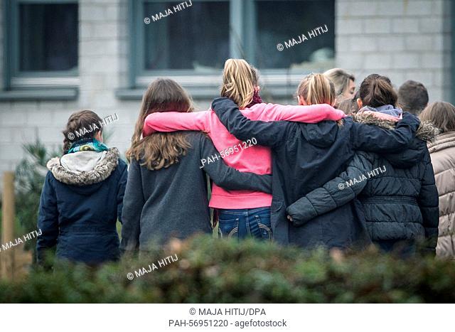 Students stand in front of the Joseph Koenig School before the school starts in Haltern am See, Germany, 25 March 2015. 16 students and 2 teachers from this...