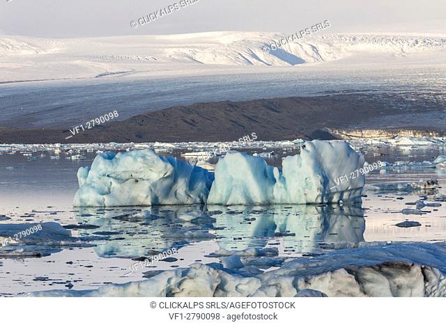 Floating icebergs and Vatnajokull Glacier on the background. Jokulsarlon Glacier Lagoon, Eastern Iceland, Europe