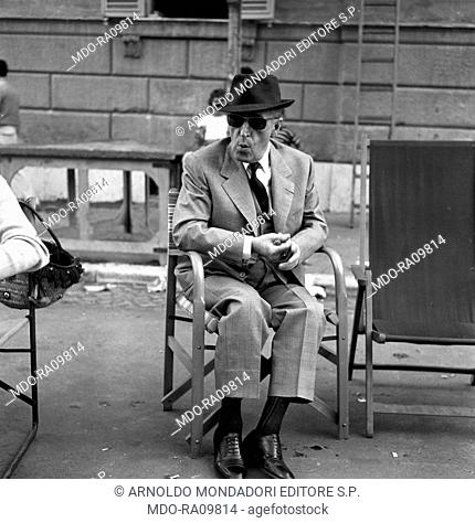Italian actor Totò (Antonio De Curtis) during a break on the set of Il comandante. Rome, 1963