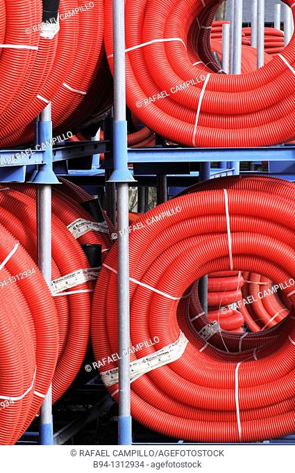Red plastic tubing for construction