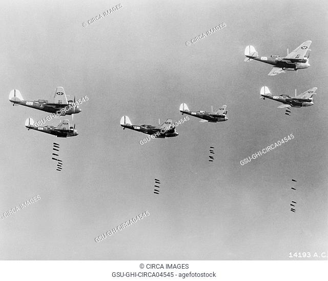 600-pound Bombs falling from Formation of B-10 Bombers in Bombing Practice by 19th Bombardment Group, U.S. Army Air Corps, Office of War Information