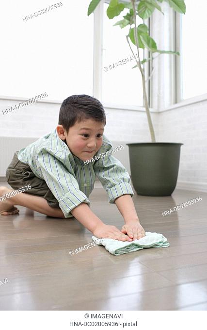 A boy cleaning up