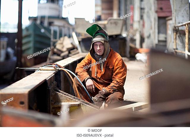 Portrait of welder in shipyard workshop