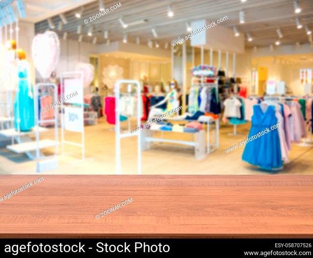 clothes in fashion store, blurred interior of cloth store