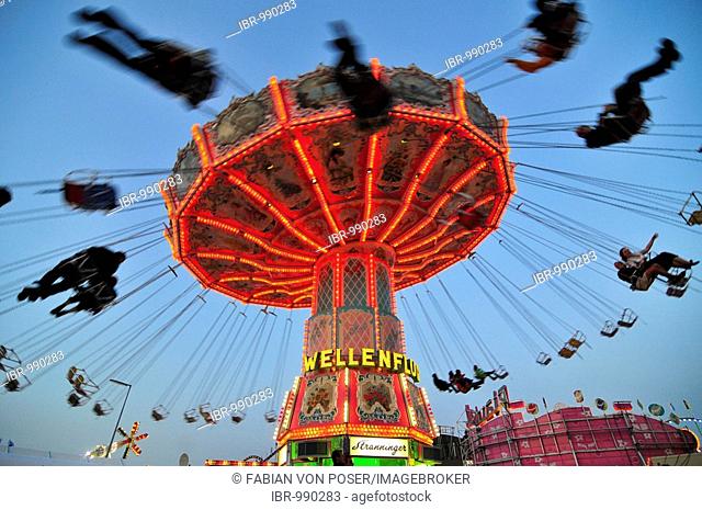 Chair-O-Planes or swing carousel at dusk, Octoberfest, Munich, Bavaria, Germany, Europe