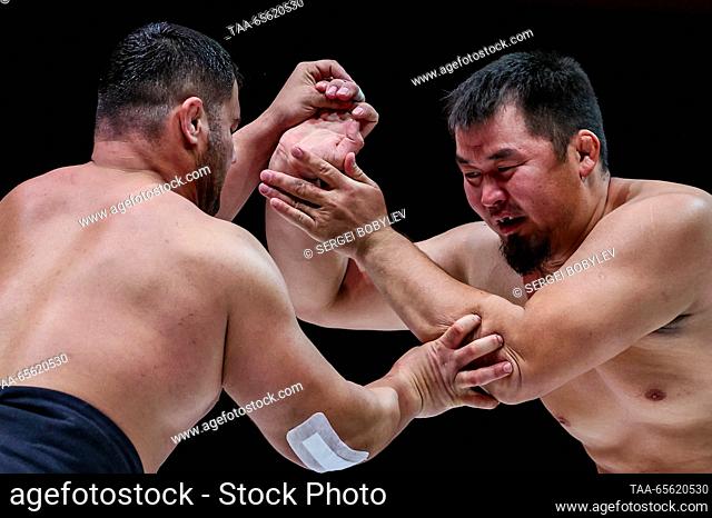 RUSSIA, MOSCOW - DECEMBER 10, 2023: The men's bronze-medal openweight bout between Aidyn Mongush of Russia and Amir Ghajar of Iran takes place as part of the...