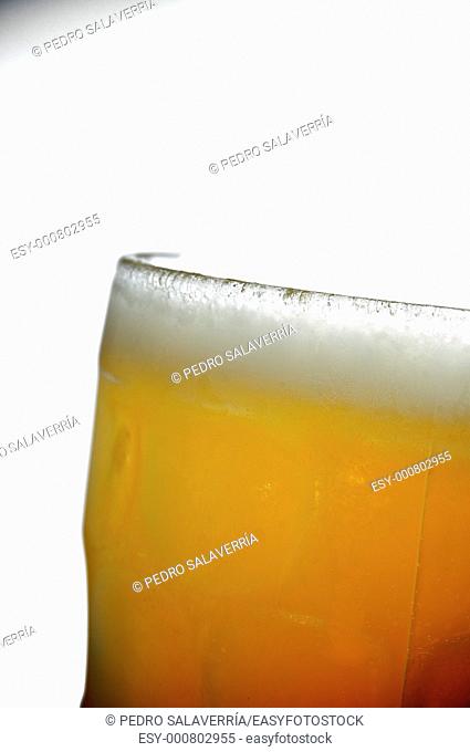 foreground of a cold pitcher of beer