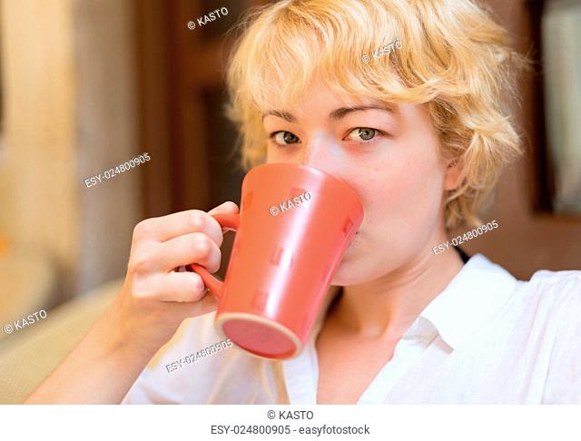 Casual Dressed Beauty Girl With Cup of Coffee