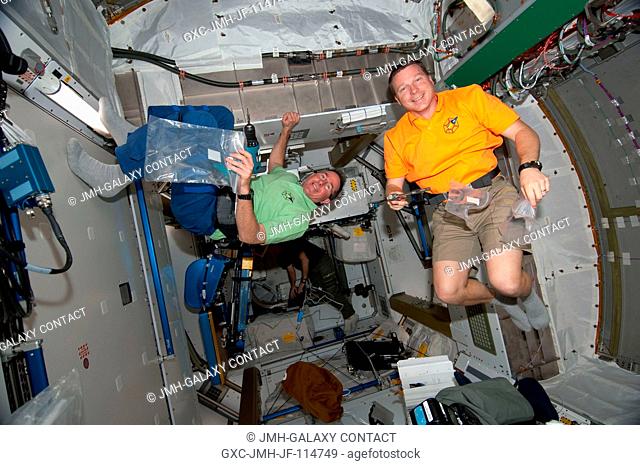 NASA astronauts Terry Virts (right), STS-130 pilot; and Stephen Robinson, mission specialist, are pictured in the newly-installed Tranquility node of the...