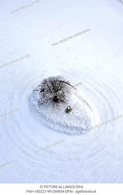 Snow covering an old burial mound in Gross Stieten, Germany, 27 February 2018 (aerial shot taken with a drone). The Michelenburg burial mount was first recorded...