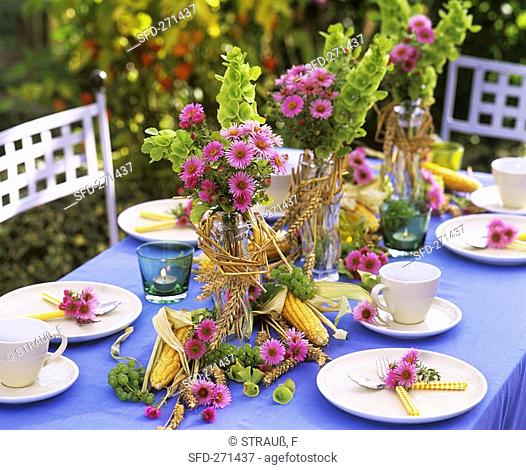 Summer table decoration with flowers