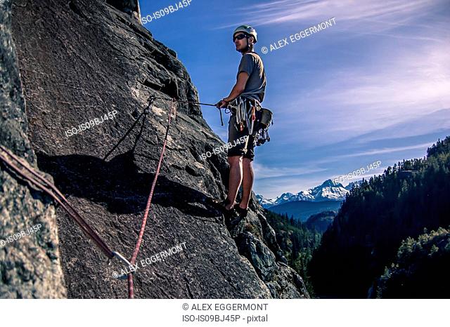 Rock climber climbing on The Chief, Malamute, Squamish, Canada