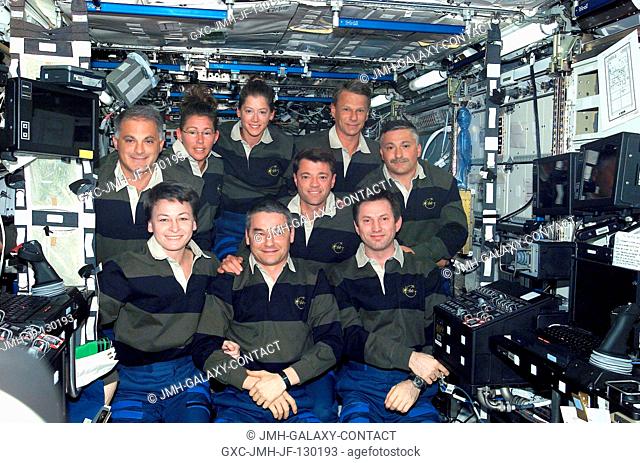 The Expedition Five and STS-112 crews assemble for a group photo in the Destiny laboratory on the International Space Station (ISS)
