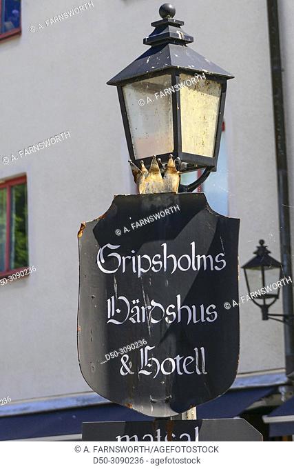 Mariefred, Sweden Lamp post and sign for the Gripsholm restaurant and hotel in the perfectly restored and charming city center of Mariefred, a small town pop