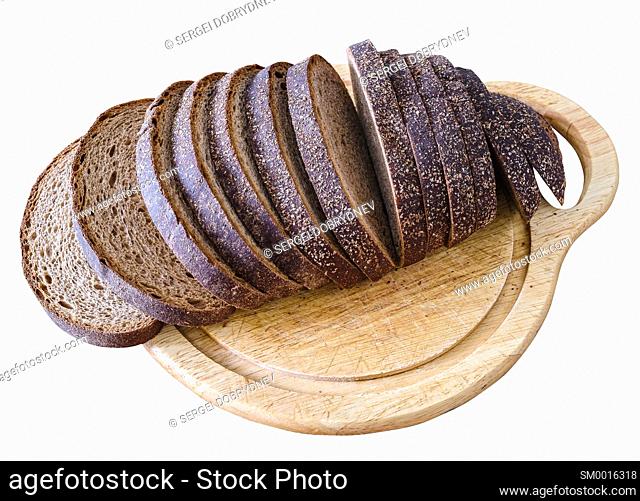 Sliced loaf of rye bread on a cutting board isolated on white