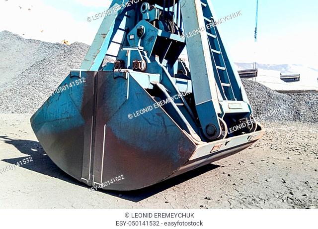 Clamshell bucket in the cargo port. Bucket for loading coal