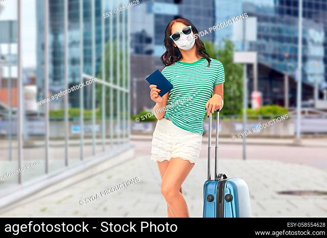 teenage girl in mask with travel bag and passport