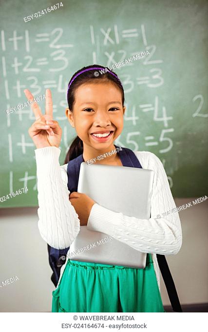 Schoolgirl doing the peace sign