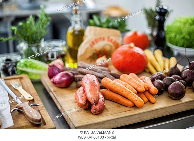 Different fresh vegetables on chopping board
