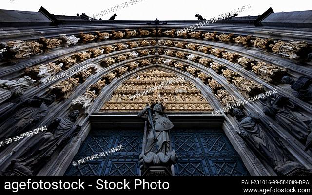 16 October 2023, North Rhine-Westphalia, Cologne: The archivolts and the tympanum from the St. Michael's portal at Cologne Cathedral can be seen again without...
