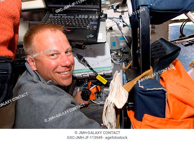 Astronaut Tim Kopra, STS-127 mission specialist, is pictured on the aft flight deck of Space Shuttle Endeavour during flight day two activities