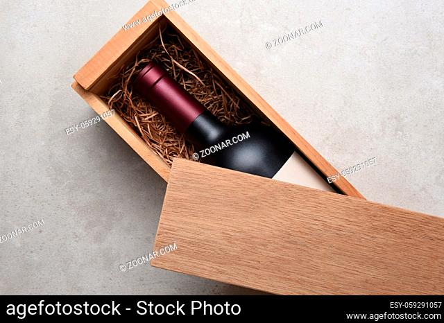 Cabernet Wine Box: A single bottle of red wine in a wood box partially covered by its lid