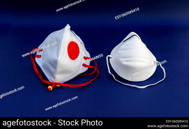 Prevent coronavirus. Medical mask, Medical protective mask isolated on blue background. Disposable surgical face mask cover mouth and nose