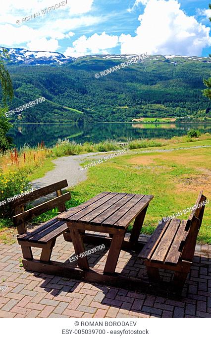 Picnic table and benches near lake in Norway, Europe