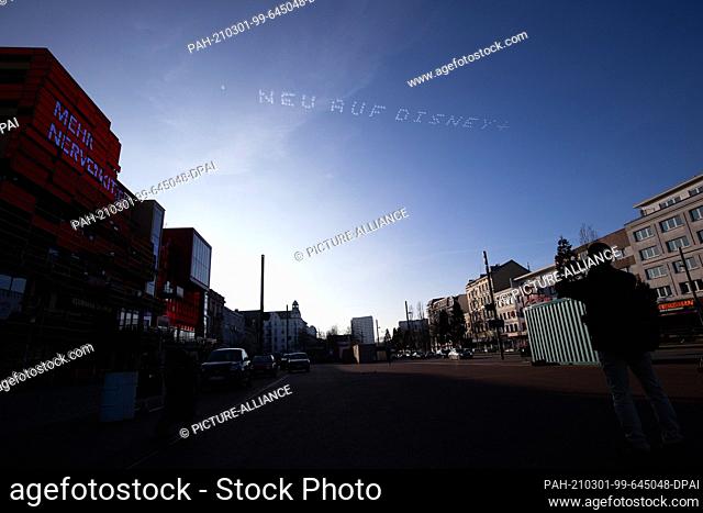 01 March 2021, Hamburg: The words ""New on Disney +"" can be read in the sky above the Reeperbahn. As part of an advertising campaign for a streaming service