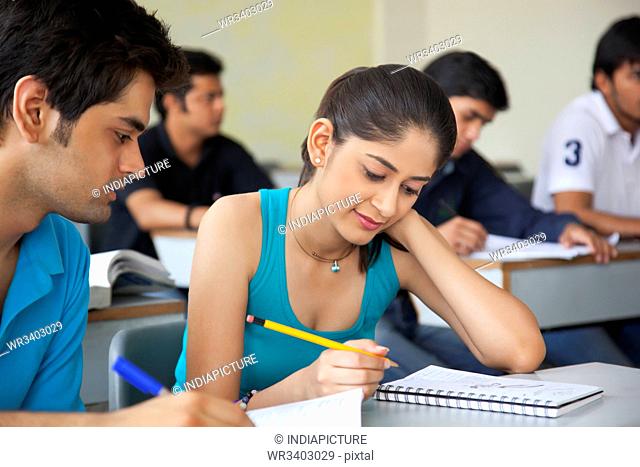 College students studying in classroom