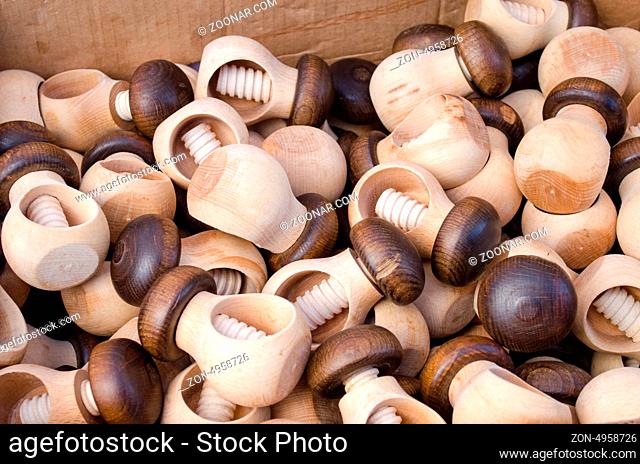 closeup of wooden handmade nut crush crack nutcracker tools sold in market fair