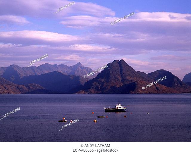 Scotland, Argyll and Bute, Isle of Skye, Sgurr na Stri and the main Cuillin ridge seen from Elgol. The boat, Bella Jane, runs trips to Loch Coruisk in the heart...