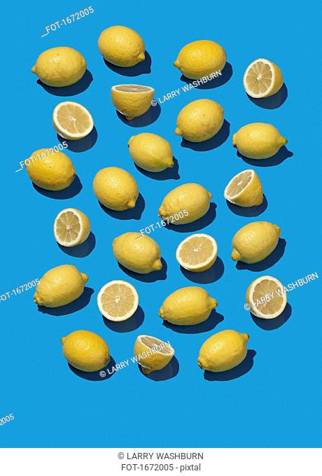 High angle view of lemons on blue background