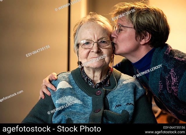 38 yo daughter in law kissing her 85 yo mother, Tienen, Flanders, Belgium