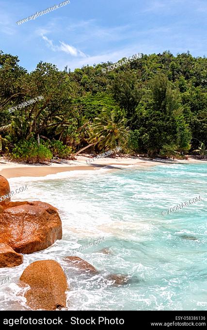 Beach Anse Georgette Praslin island Seychelles portrait format symbolic photo vacation sea water