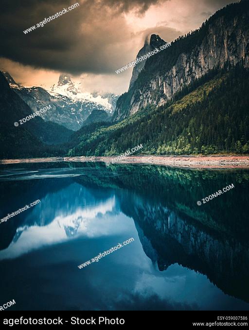 Alpine lake with dramatic sky and mountains. UNESCO heritage site. Gosausee, Tirol, Austria