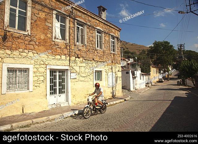 Motorcyclist in front of the traditional Ottoman-Greek houses at the old town of Bergama, Izmir, Aegean Region, Turkey, Europe