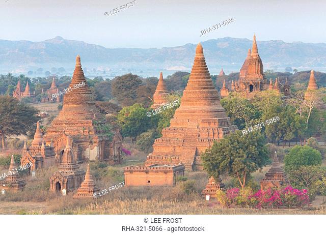 View over the temples of Bagan swathed in early morning mist, from Shwesandaw Paya, Bagan, Myanmar (Burma), Southeast Asia