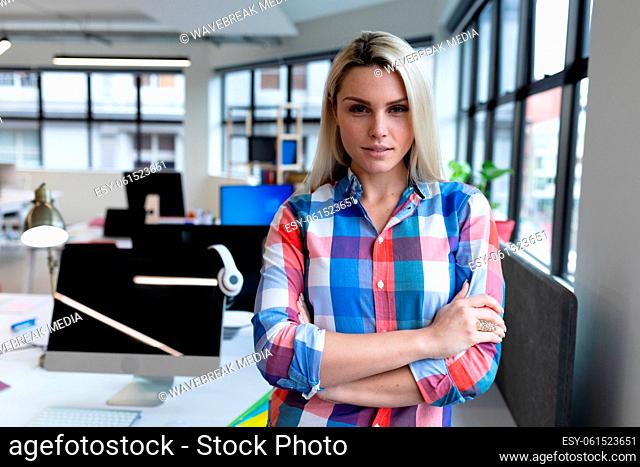 Portrait of caucasian businesswoman in creative office