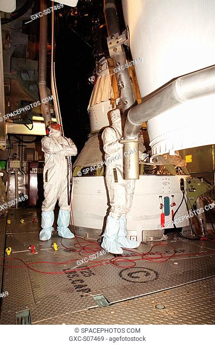 06/26/2001 -- Workers at Launch Complex 17-B, Cape Canaveral Air Force Station, oversee the fairing installation on the Microwave Anisotropy Probe MAP...
