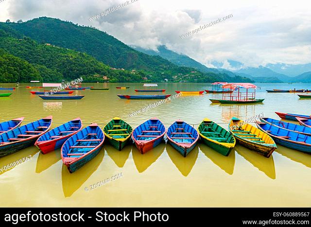 Colorful small boats on Phewa Lake in Pokhara, Nepal