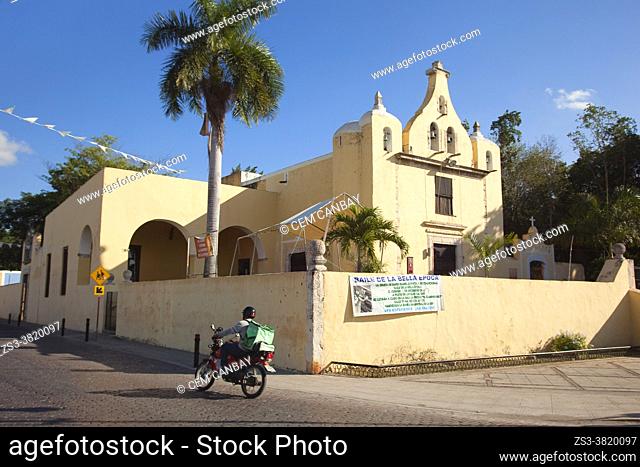 Motorcyclist in front of the Iglesia De La Ermita De Santa Isabel church at the historic center, Merida, Yucatan Province, Mexico, Central America