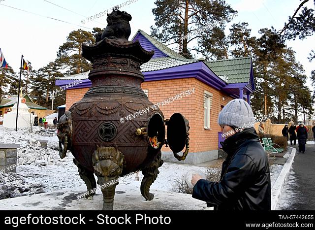 RUSSIA, CHITA - FEBRUARY 19, 2023: A Buryat Buddhist is seen before a purification ritual known as Dugzhuuba at Damba Braibunling Datsan on the eve of Sagaalgan...